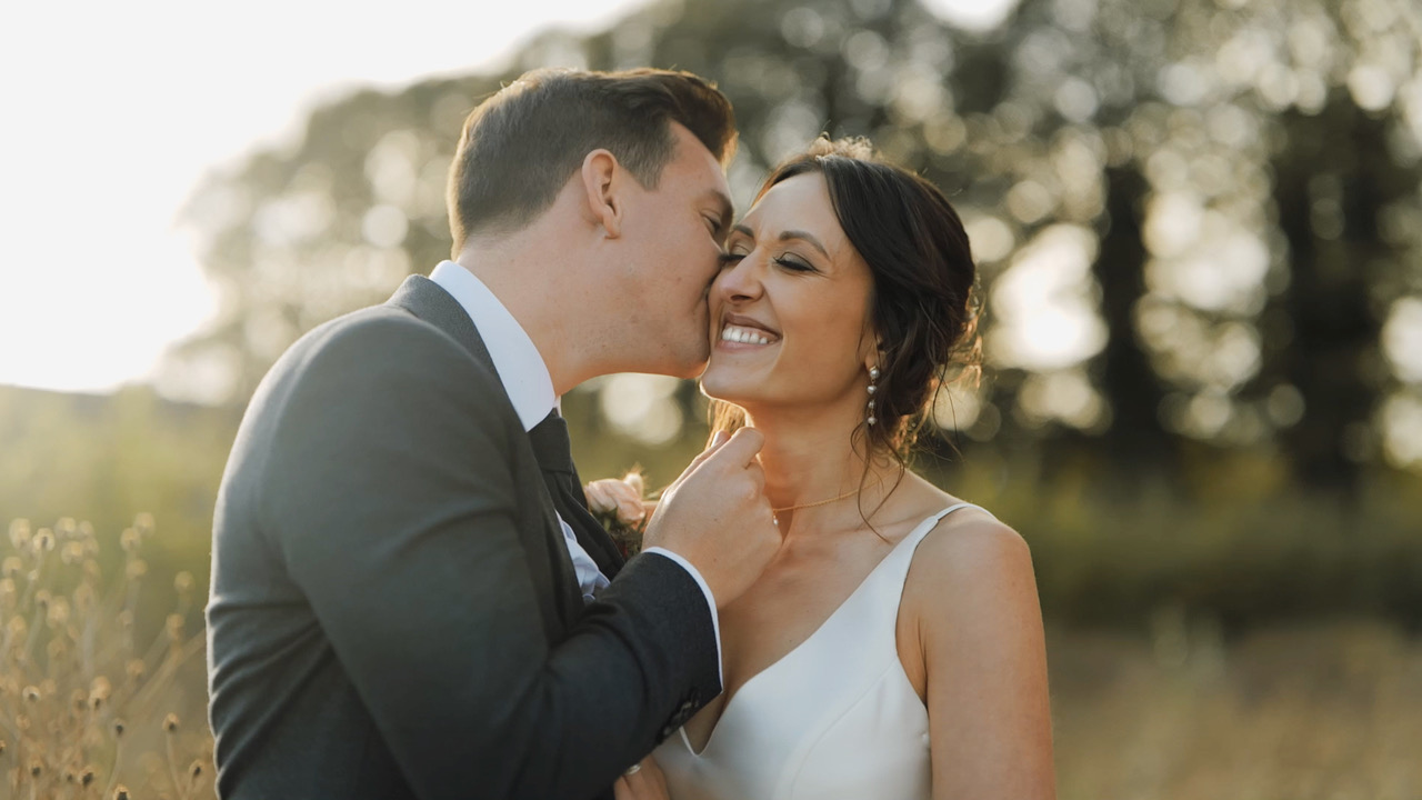 A precious moment caught between a new husband and wife in Russell Kent Nicholls' wedding video