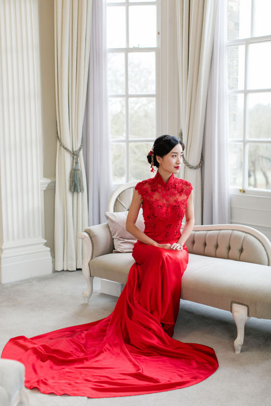 Beautiful bride in Chinese wedding dress at Hedsor House, London. Photo by Roberta Facchini